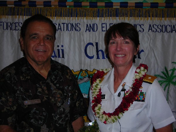 Cory Lindo, chapter president, thanks Rear Adm. Nancy A. Norton, USN, U.S. Pacific Command J-6, following her speech at the September meeting.